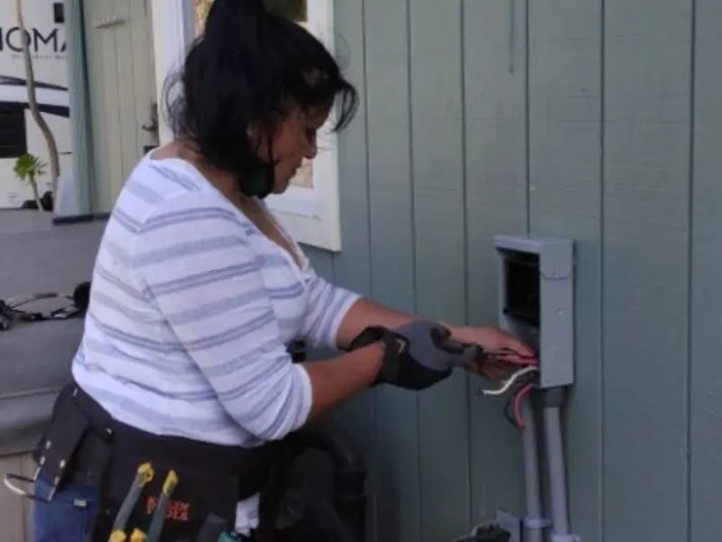 Licensed electrician wiring an exterior subpanel in Campbell