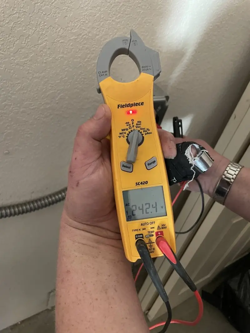 Voltage testing with clamp meter during Whole House Surge Protector in Campbell